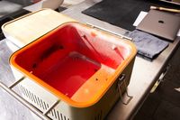 Empty Everdure Cube Portable Charcoal Grill is displayed