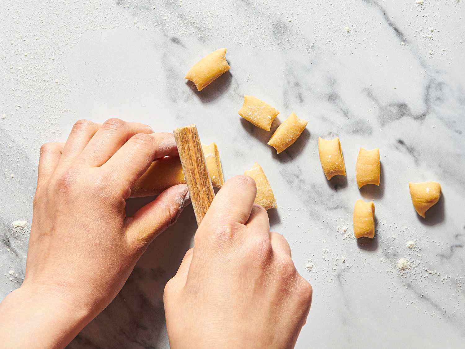 Overhead view of cutting dumplings