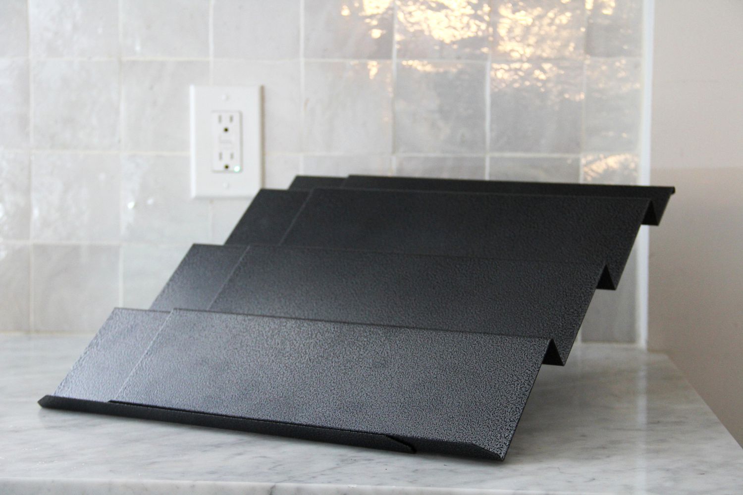 the lynx spice rack on a marble countertop
