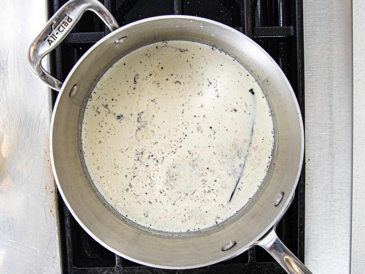 Overhead view of custard mixture in a pot on the stove