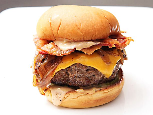 Closeup of an ultimate bacon cheeseburger.