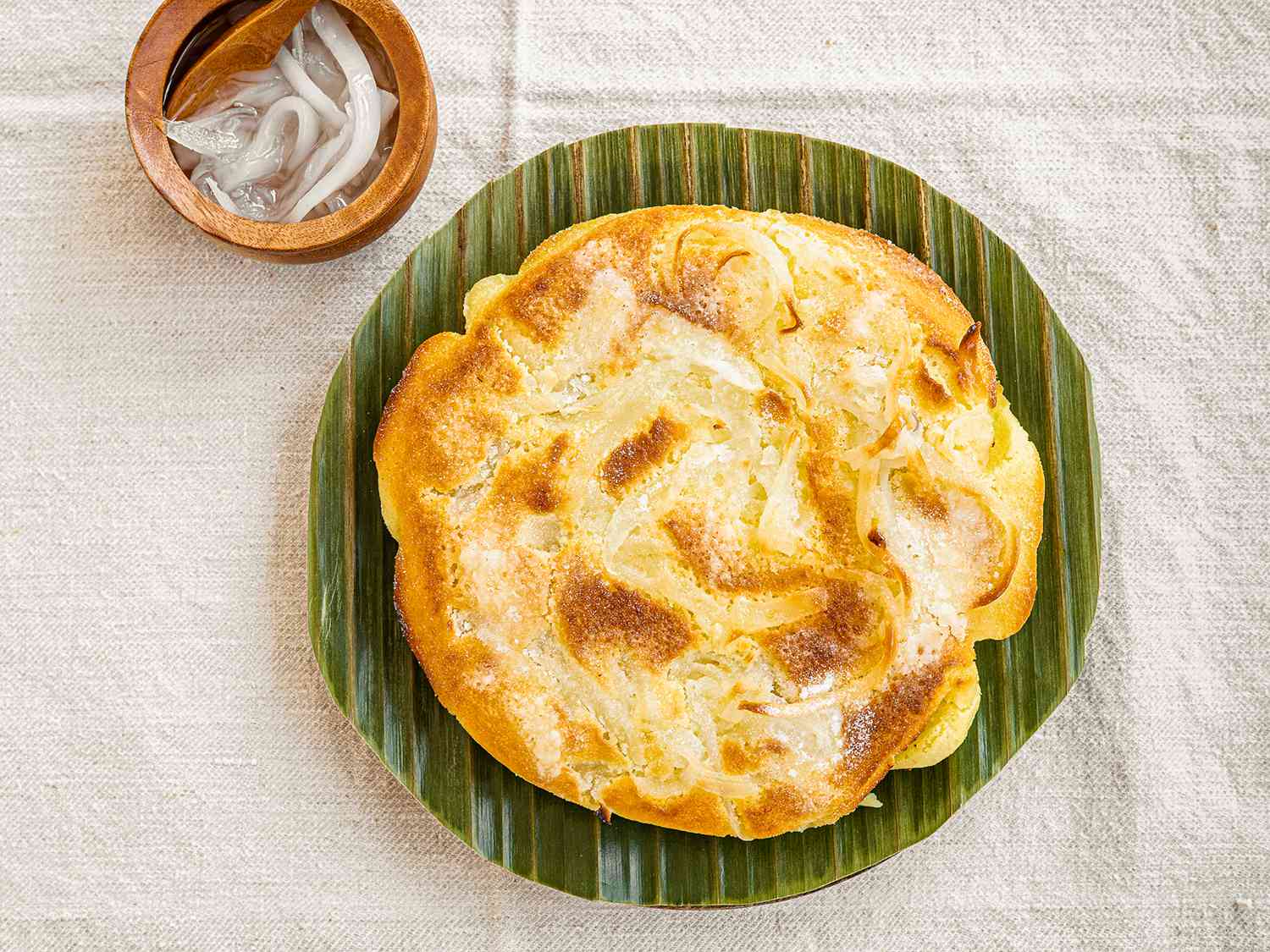 Bibingka on a banan leaf-lined serving platter