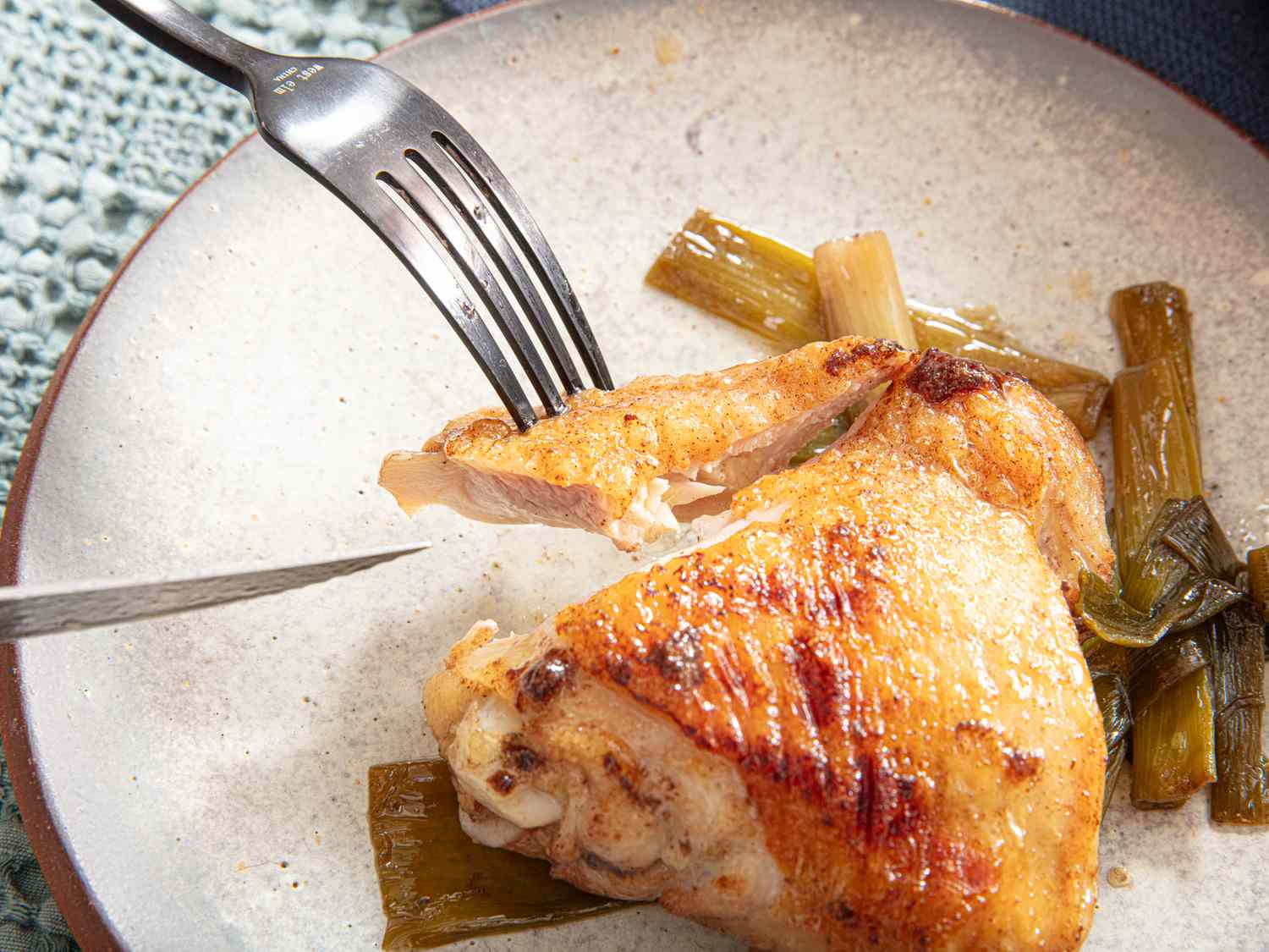 Side view of a bite of chicken