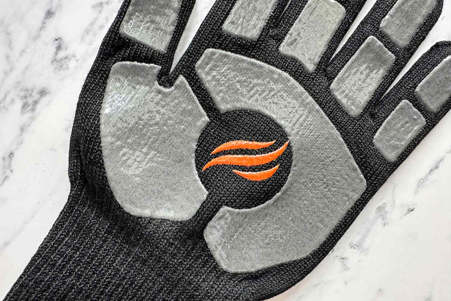 A fire graphic on the palm of the Blackstone Griddle Glove