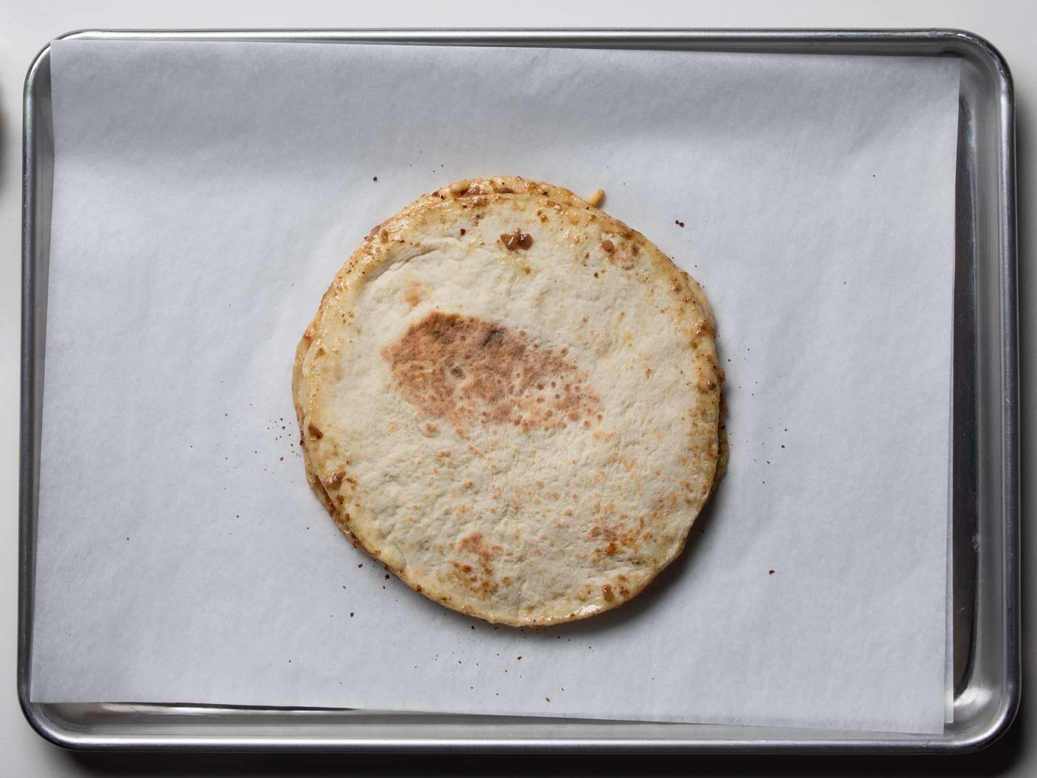 Taboon lined with onion mixture oils.