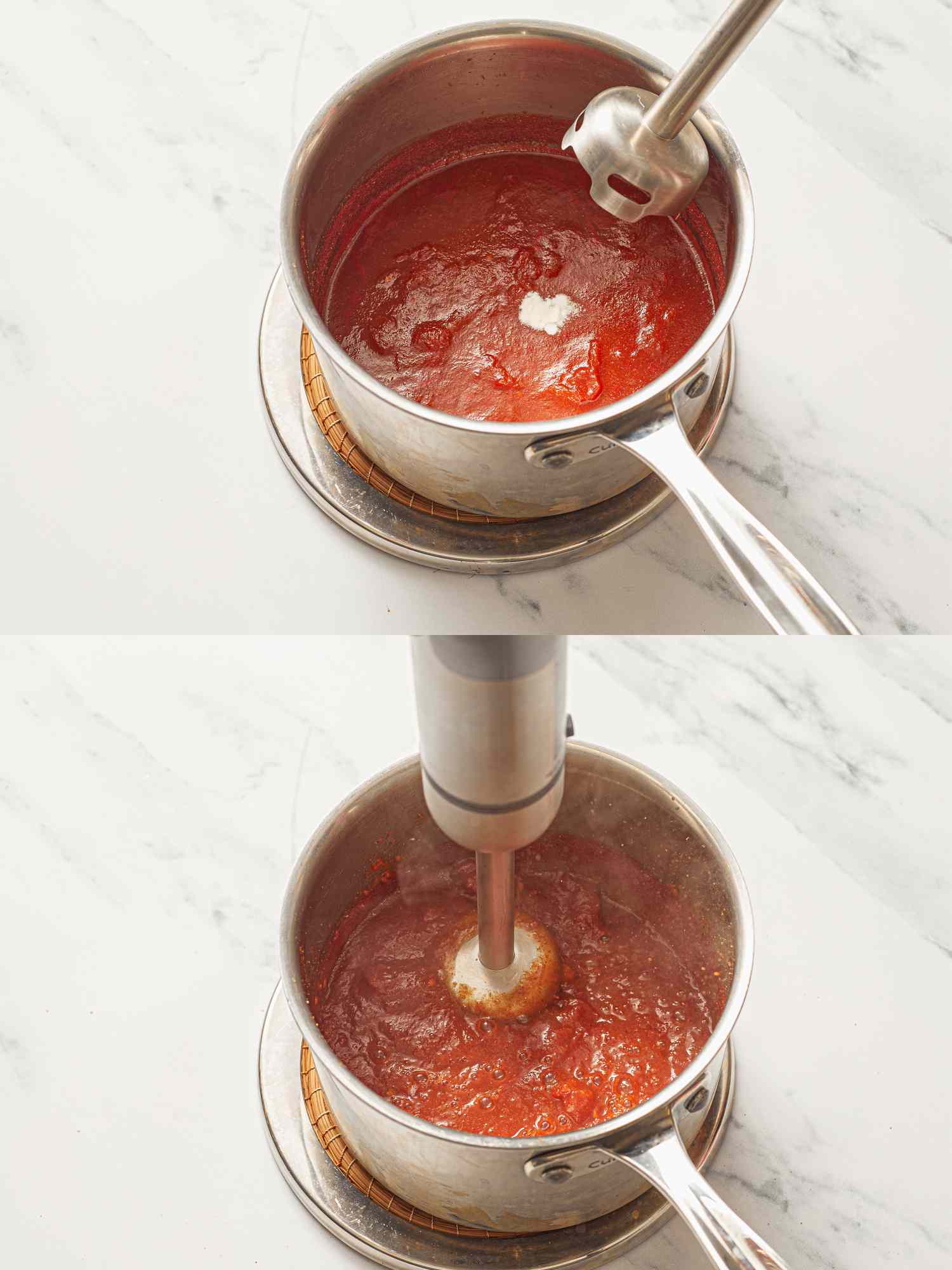 Blending tomato sauce in a saucepan using an immersion blender.