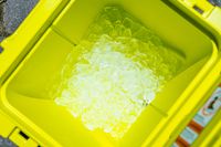 Above view of inside the Yeti Roadie 48 Rolling Wheeled Cooler filled with ice