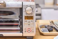 A close-up of the side panel of the Breville the Mini Smart Oven BOV450XL