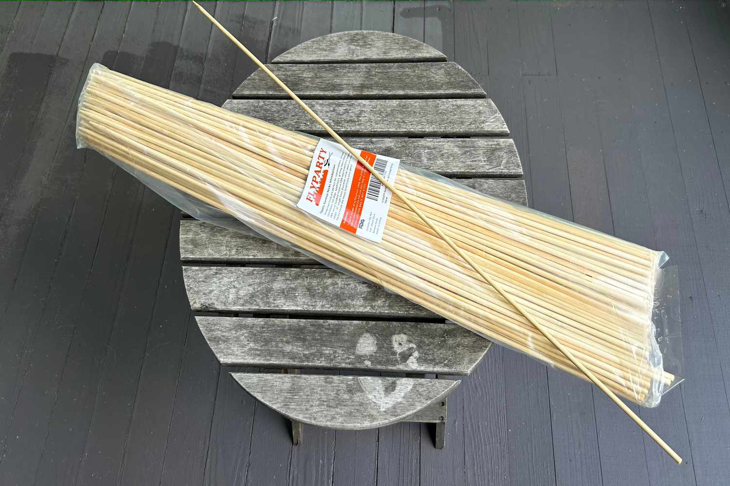 Fly Party Bamboo Marshmallow Roasting Sticks on display on an outdoor table