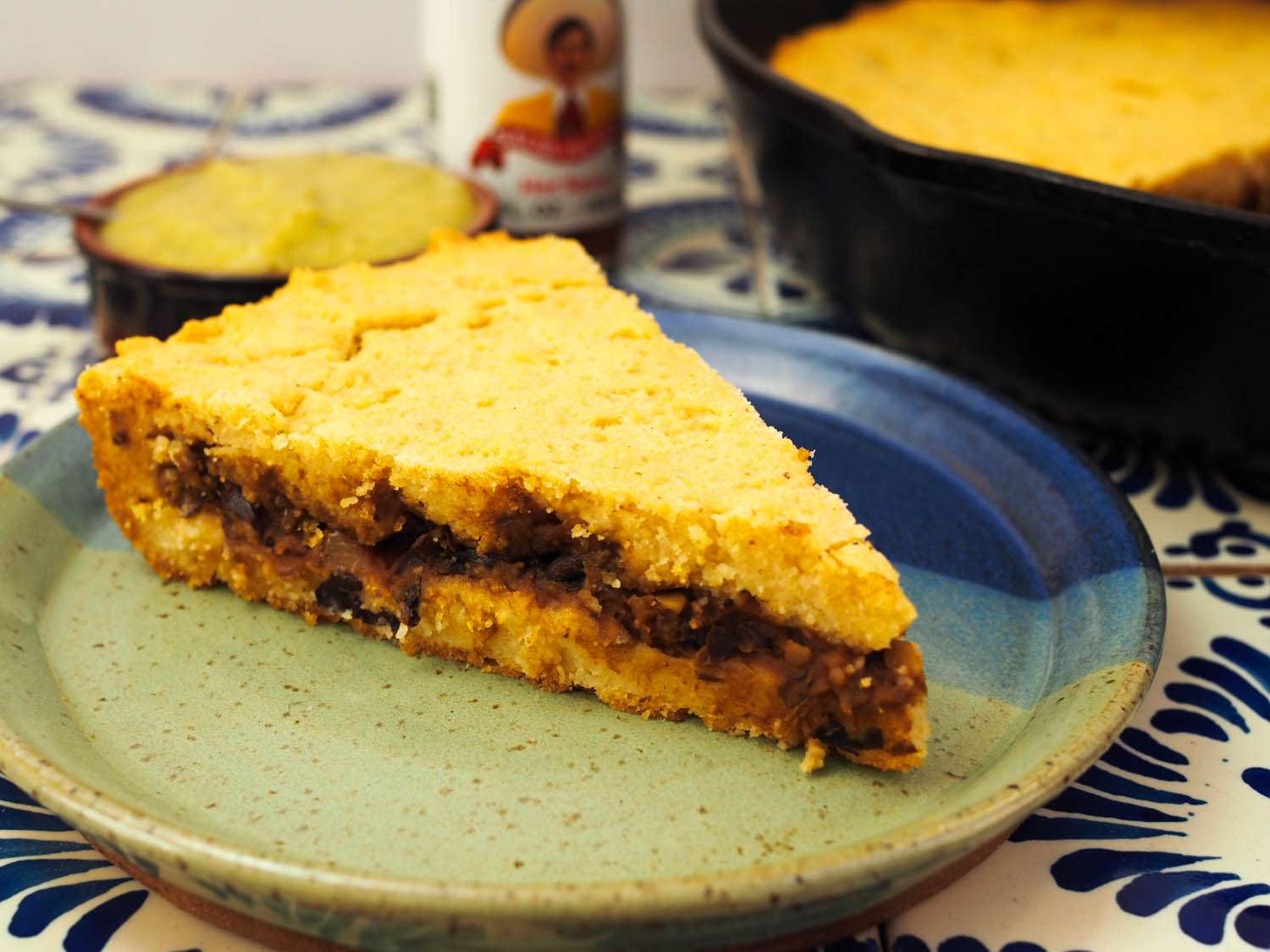 A slice of tamale pie on a plate.