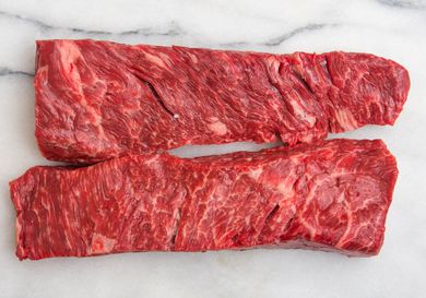 Two pieces of Bohemian cut or bottom sirloin flap meat on marble surface