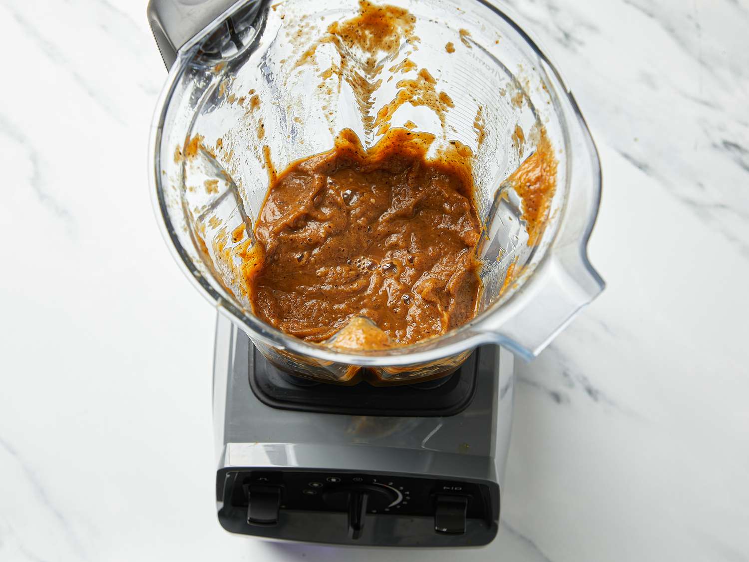  charred onion, tomatoes, jalapeños, garlic, chicken bouillon powder, black peppercorns, and cumin blended until smooth in a blender 