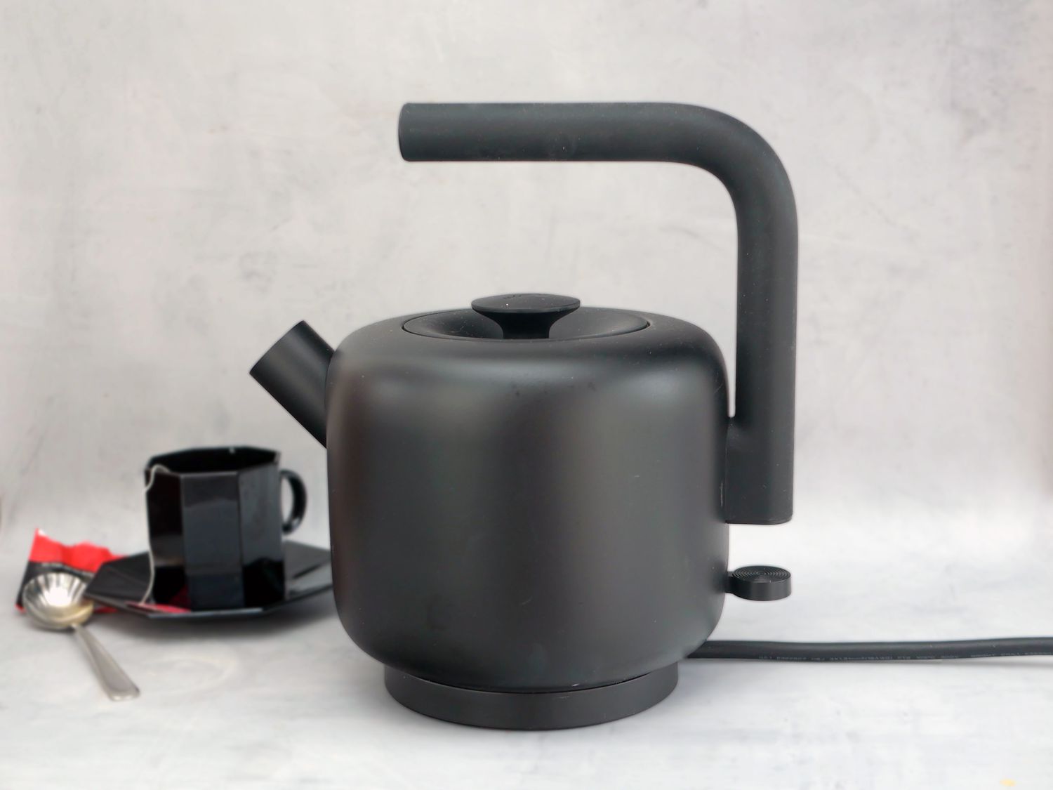 fellow clyde on a gray surface with a cup of tea in the back left corner