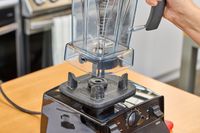 A close-up of the cup leaving the base of the Vitamix 5200 Professional-Grade Blender