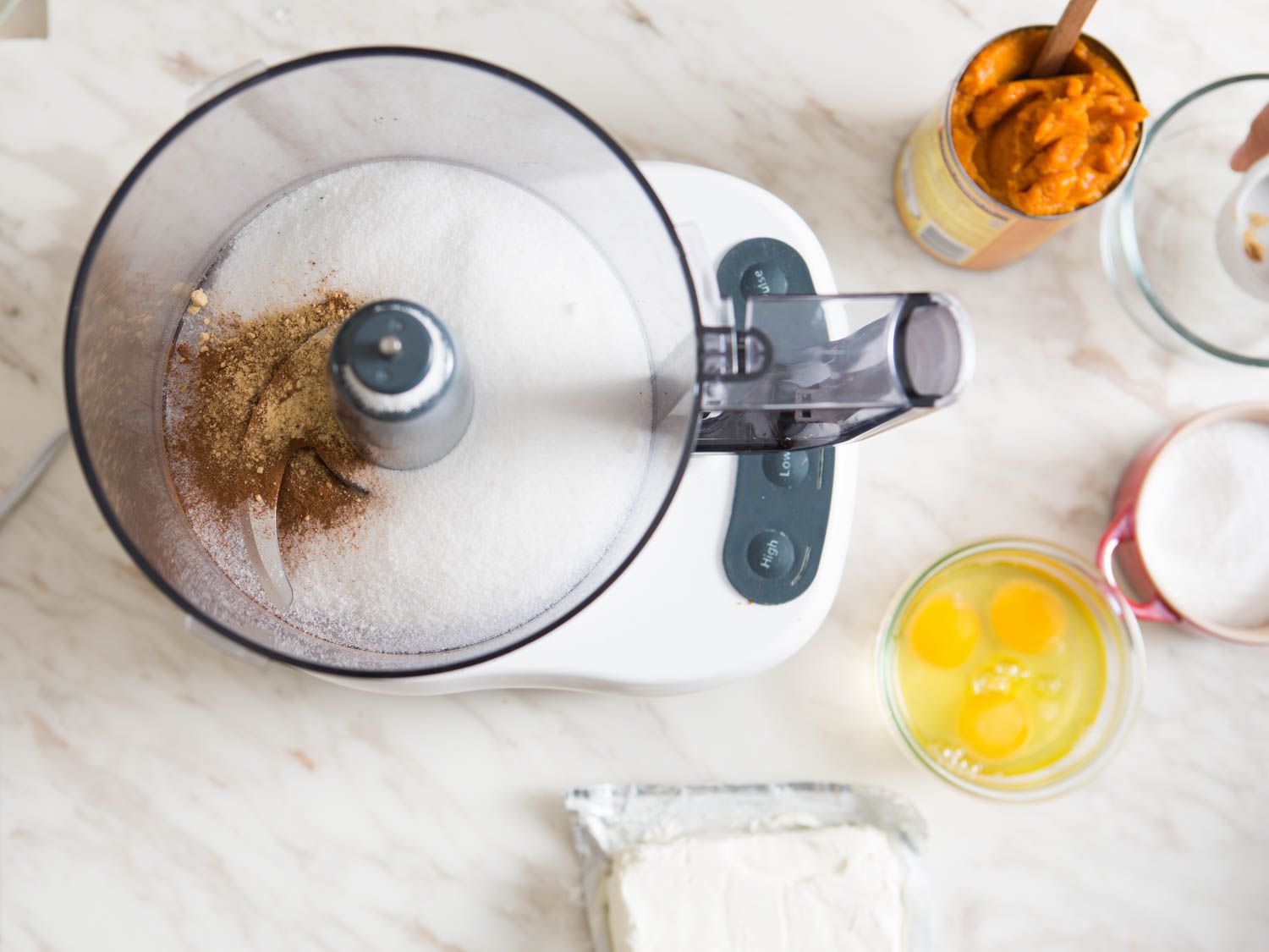 Combining spices and sugar in a food processor.