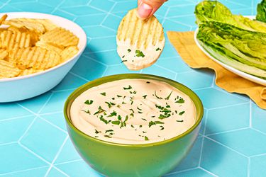 Dipping a chip in the caesar dip