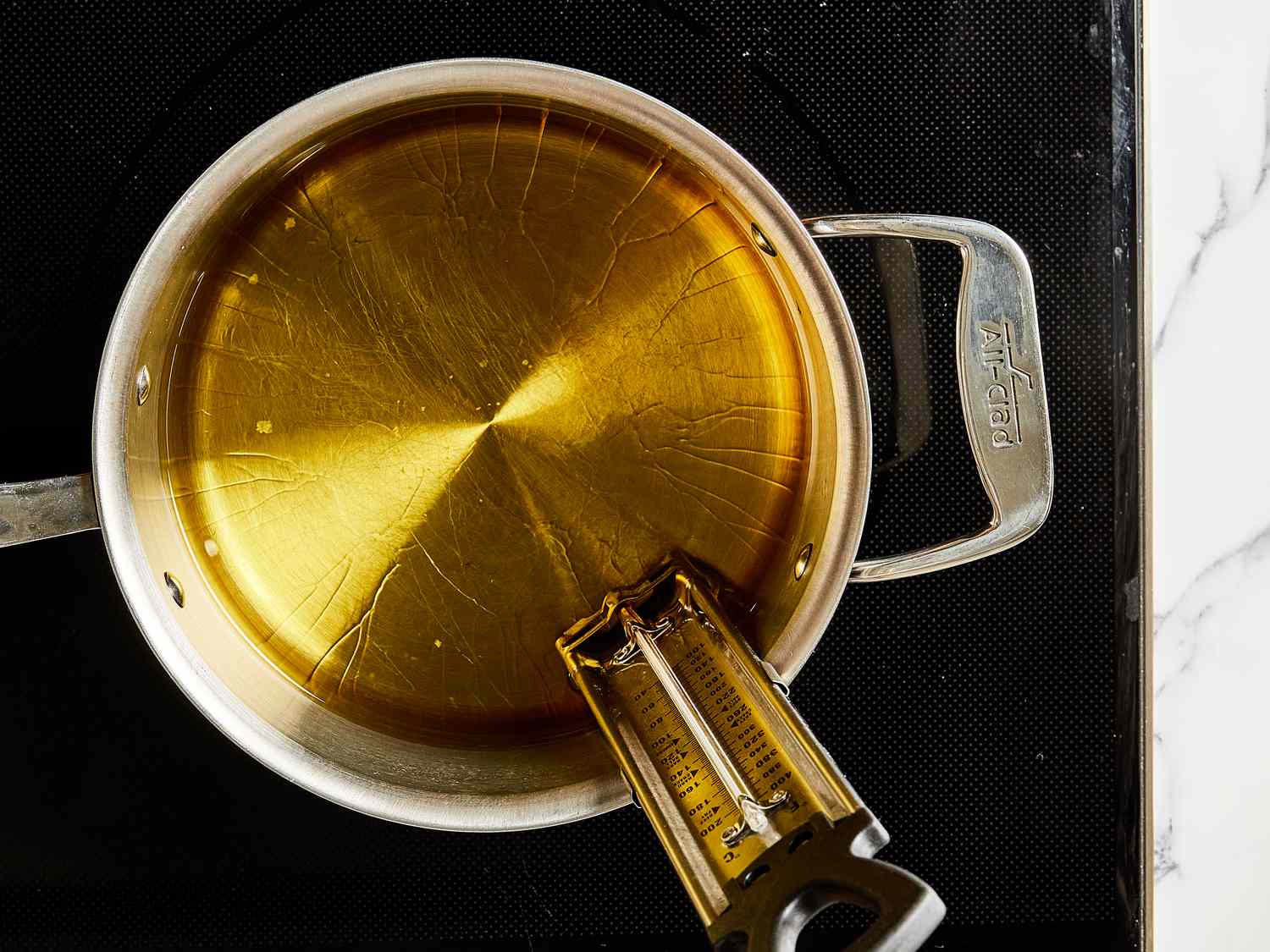 Overhead view of oil coming to temp