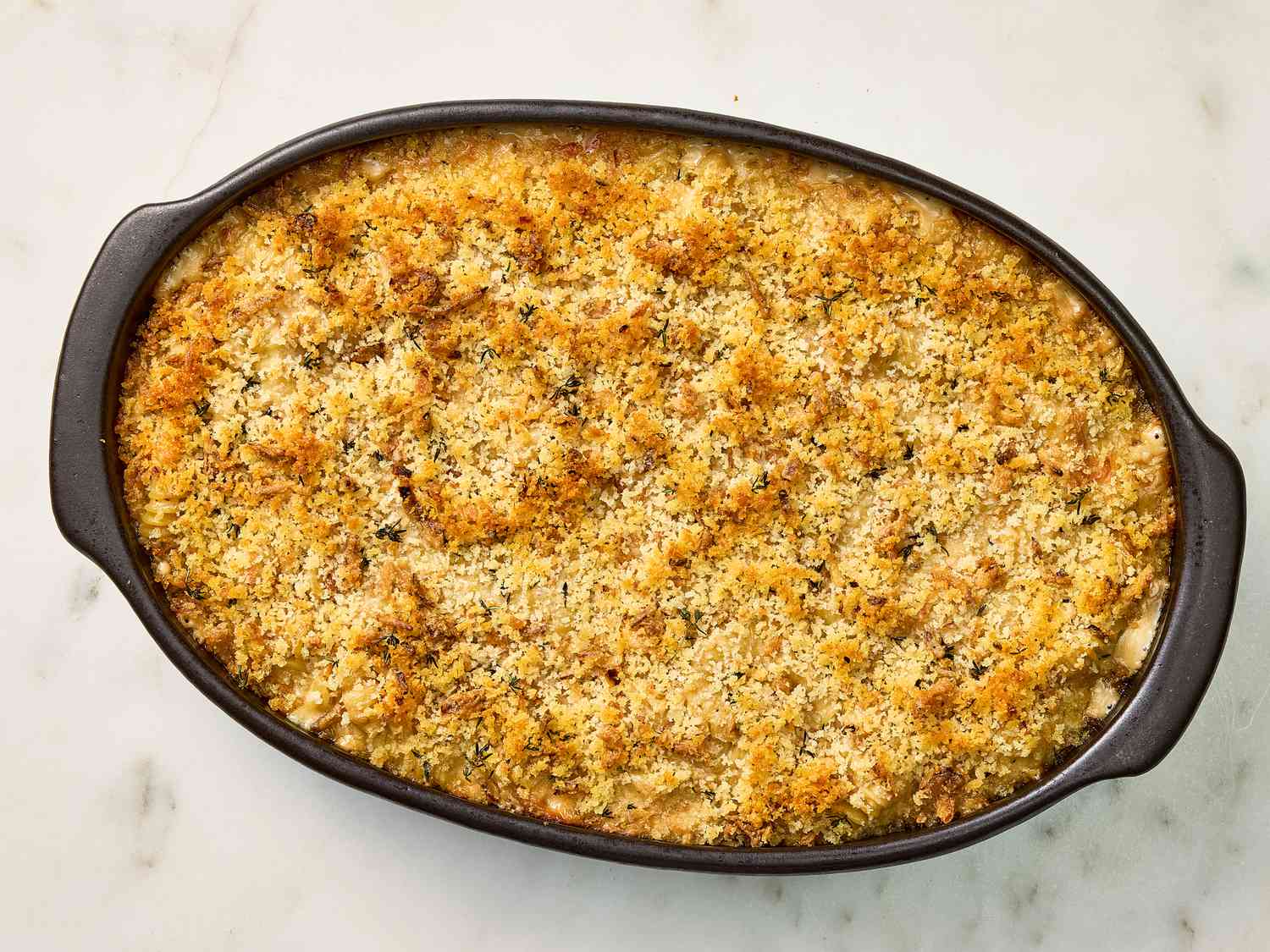 Baked mac and cheese browned on top in a baking dish 