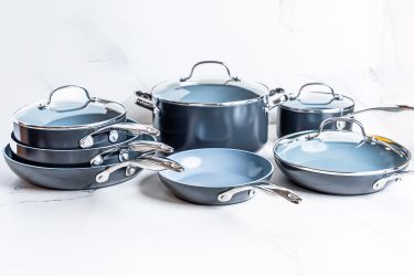 The GreenPan Valencia Pro Ceramic Nonstick 11-Piece Cookware Set on a white surface