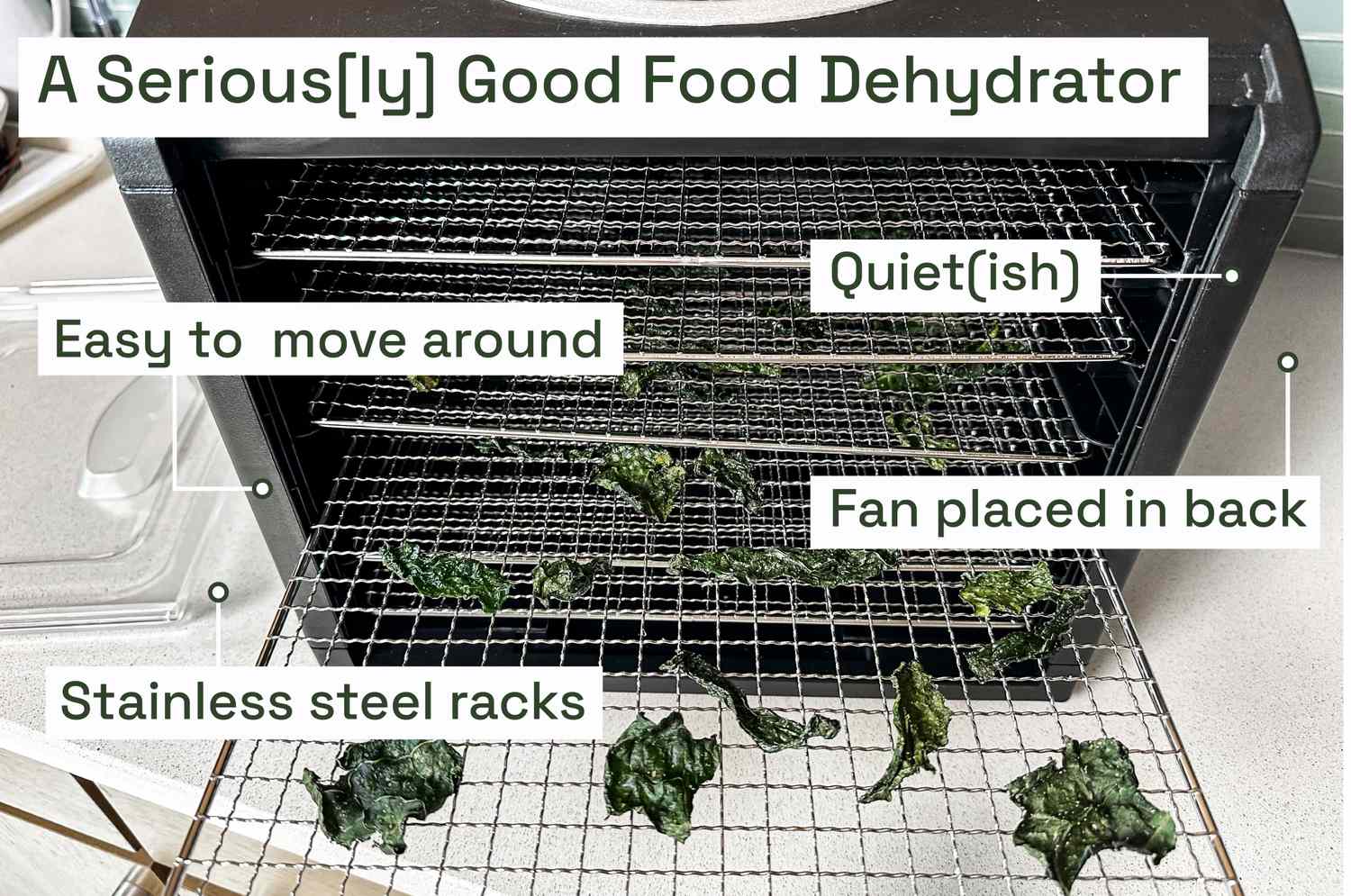 A food dehydrator with its racks filled with dried kale chips