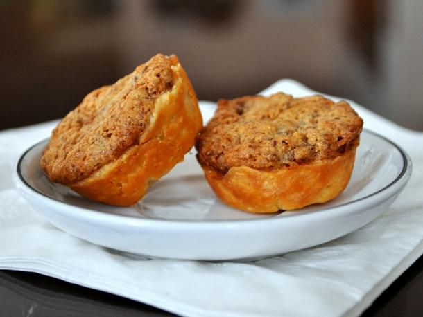 Two date-pecan caps, served on a saucer.