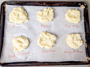 Six portions of mashed potatoes labeled by preparation method on parchment paper