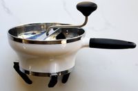 A side view of the OXO food mill showing the feet on the bottom