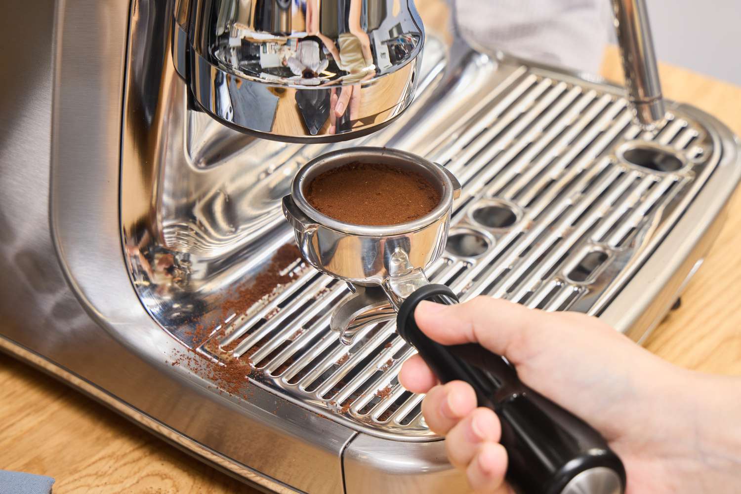A person makes espresso in the Breville The Oracle Jet Espresso Machine