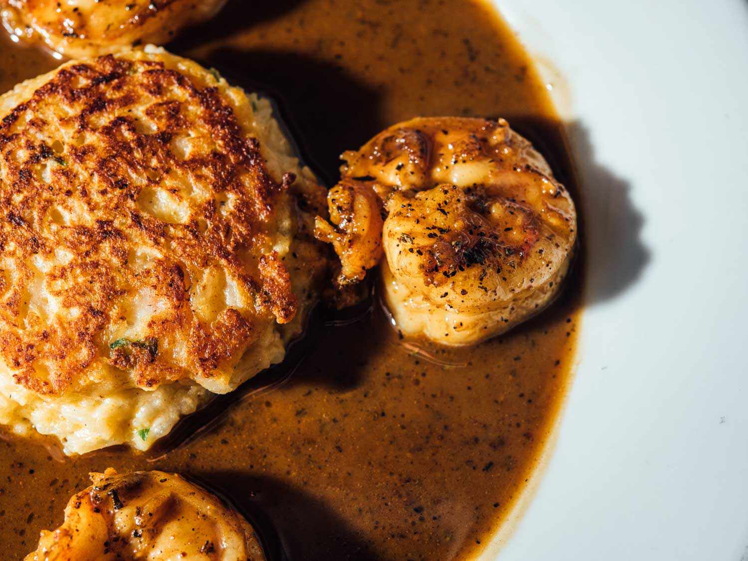 Barbecue shrimp with a calas (Creole rice fritter), bathed in sauce at Brigsten's.