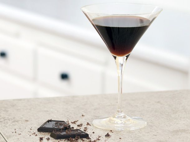 A glass of chocolate liqueur.