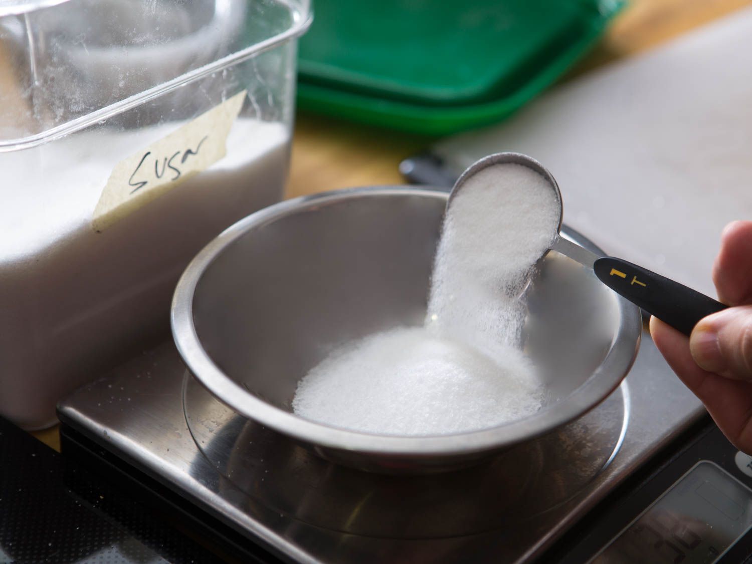 Measuring sugar for gravlax cure.