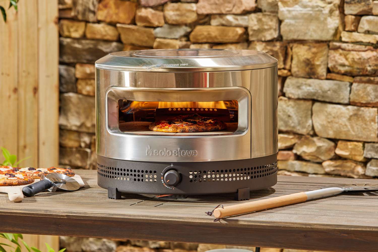 The Solo Stove Pi Prime Pizza Oven cooking a pie