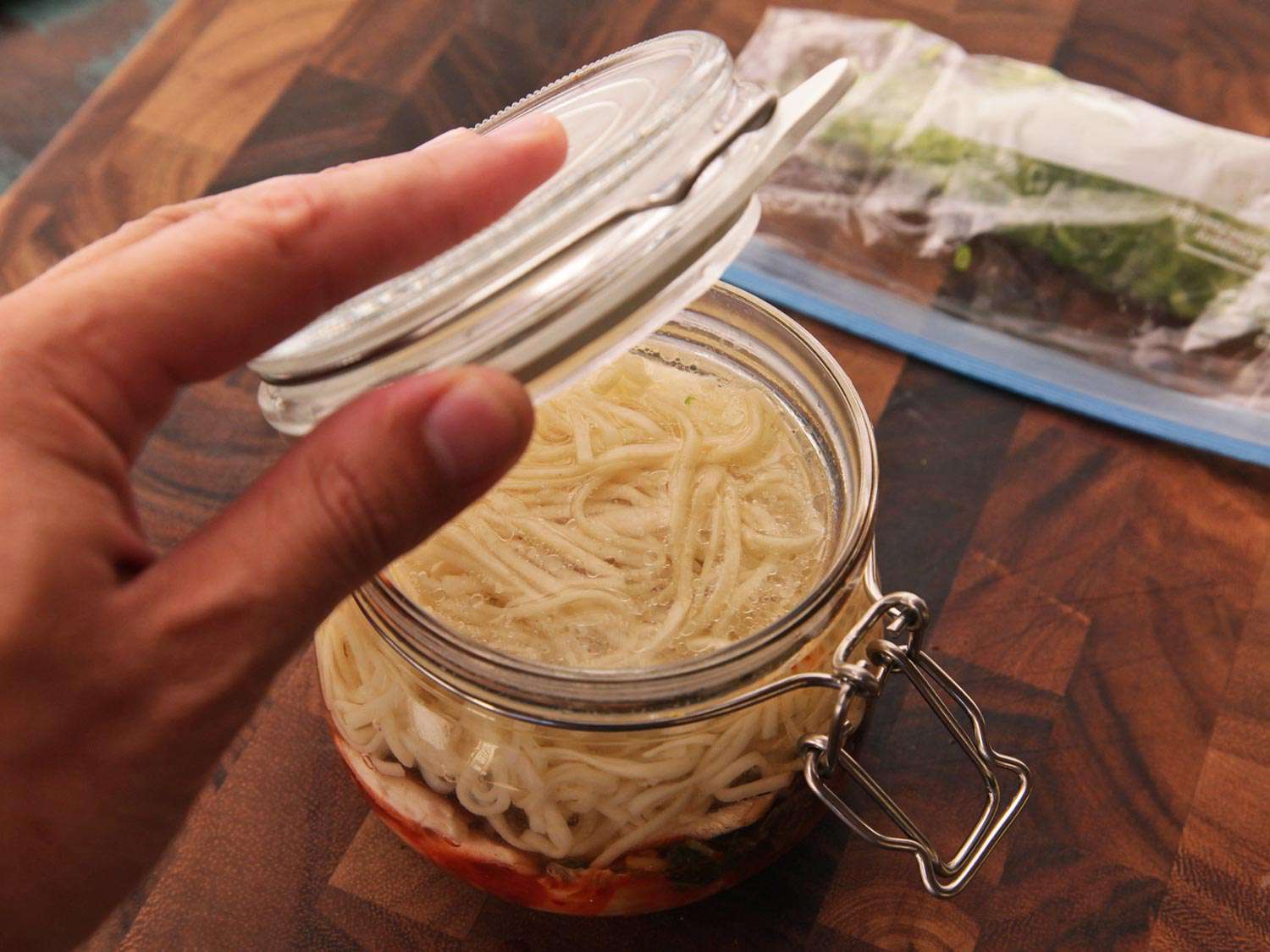 The lid of the clip top jar is closed to allow the contents to steep.