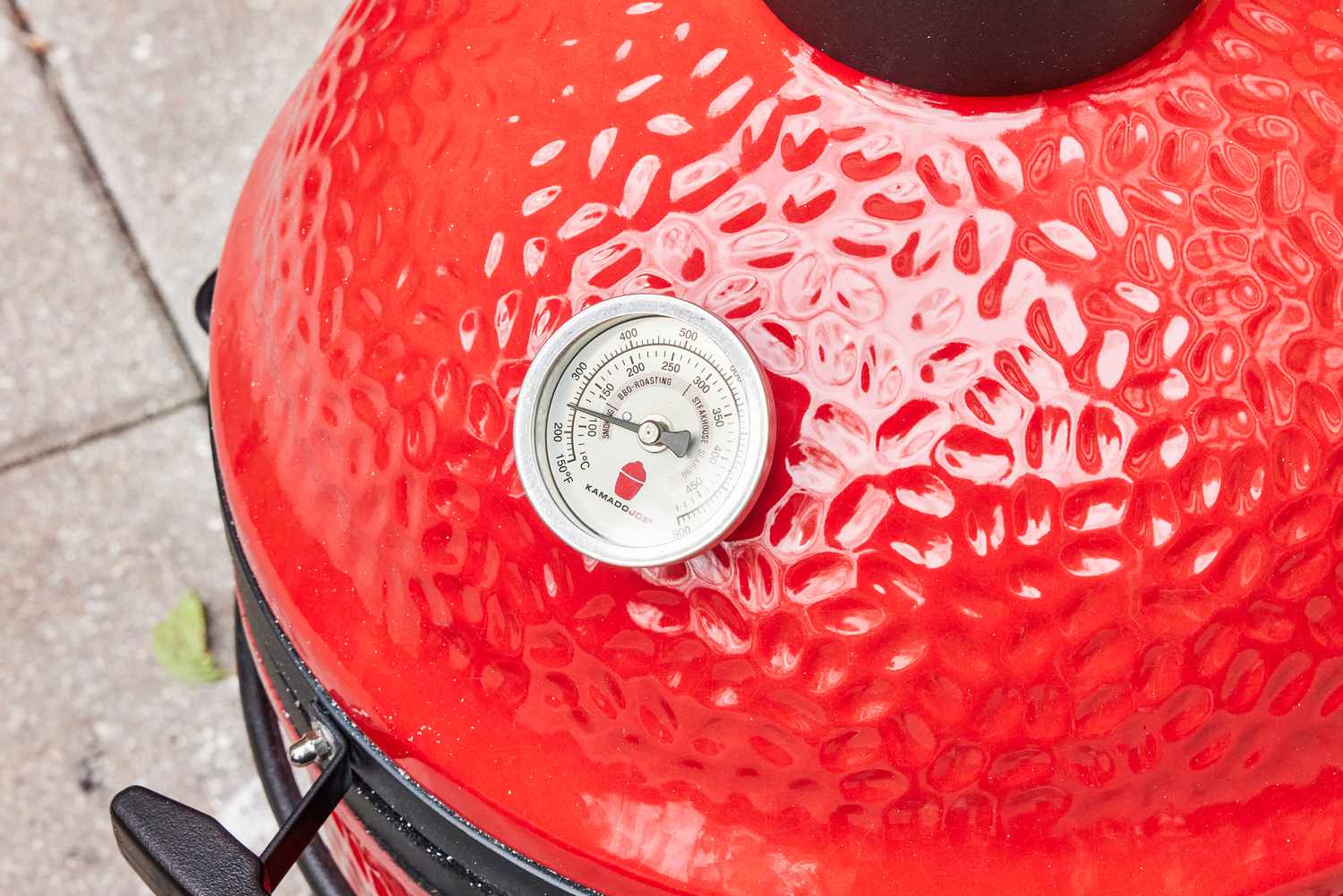 The temperature gauge on the Kamado Joe KJ13RH 13.5 inch Joe Jr. Charcoal Grill