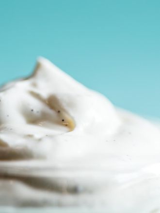 Whipped Greek yogurt dolloped into a glass dish