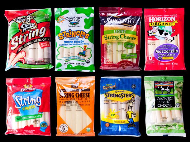 An assortment of eight different packages of string cheese. 