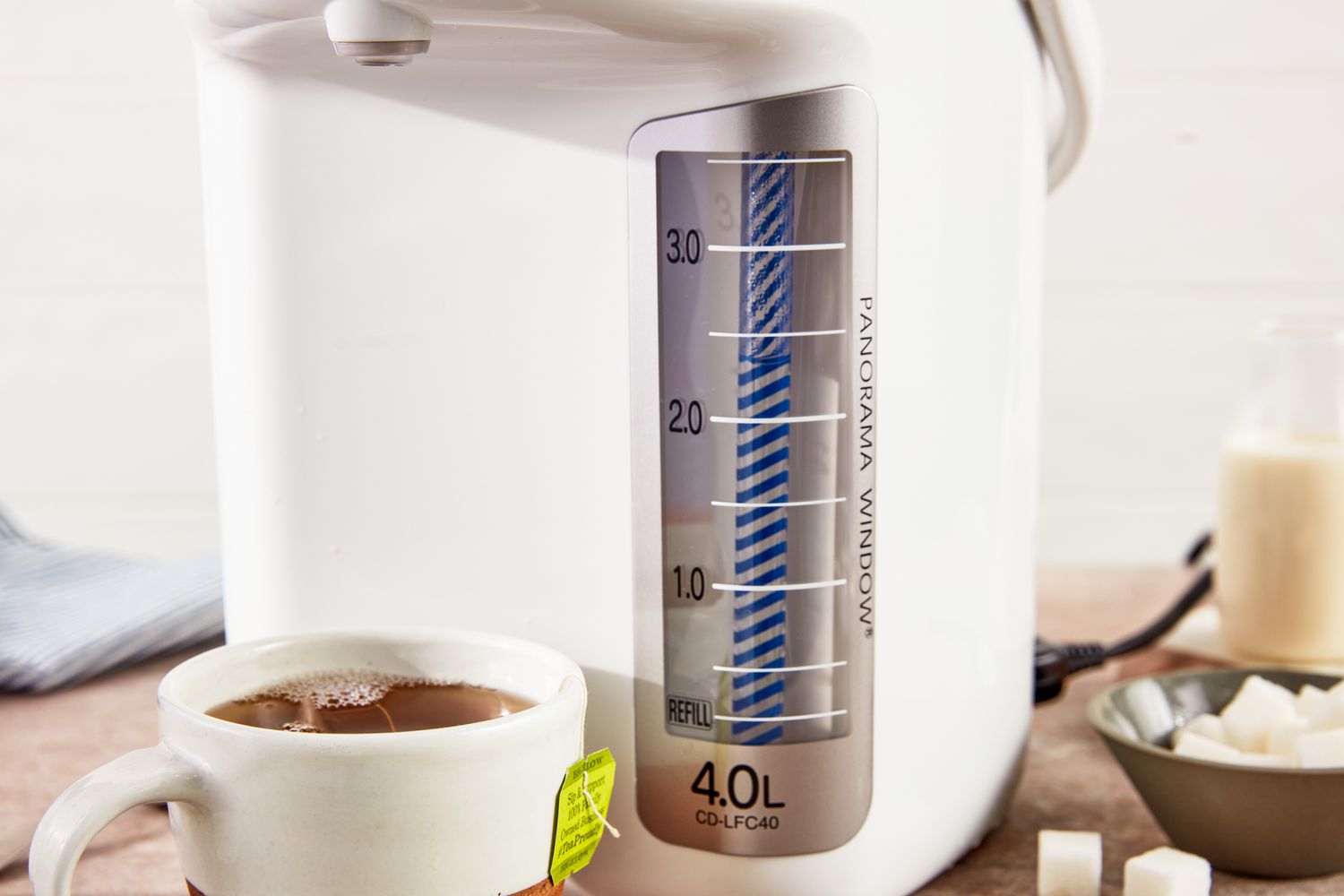 A white hot water dispenser.