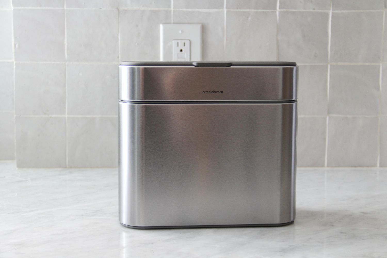 SimpleHuman compost caddy sitting on a counter
