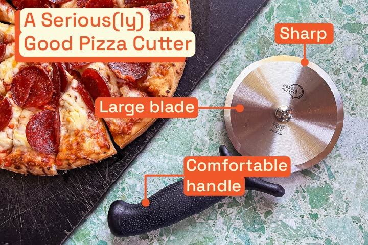 a pizza cutter next to a sliced pizza
