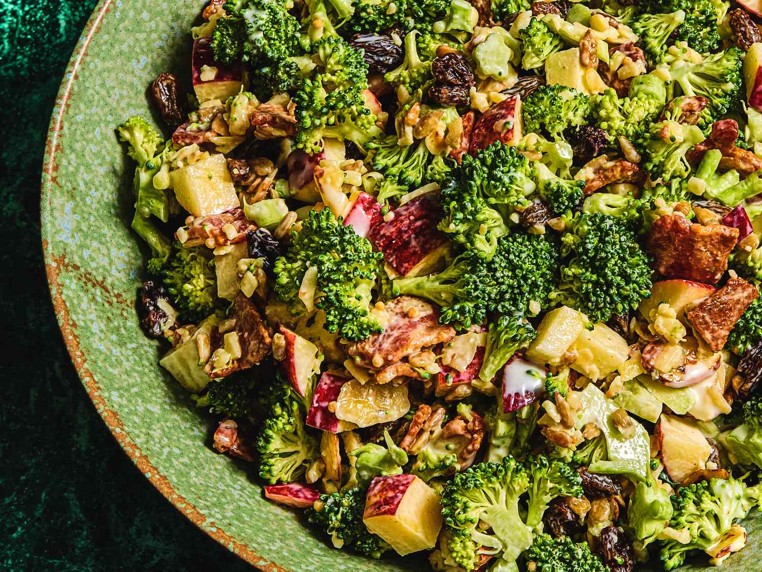 Bowl of broccoli salad with assorted toppings