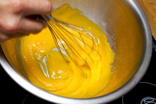 Whisking together sugar and egg yolks until silky. 