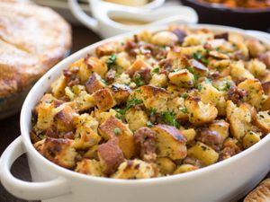 A white casserole dish filled with Thanksgiving bread stuffing