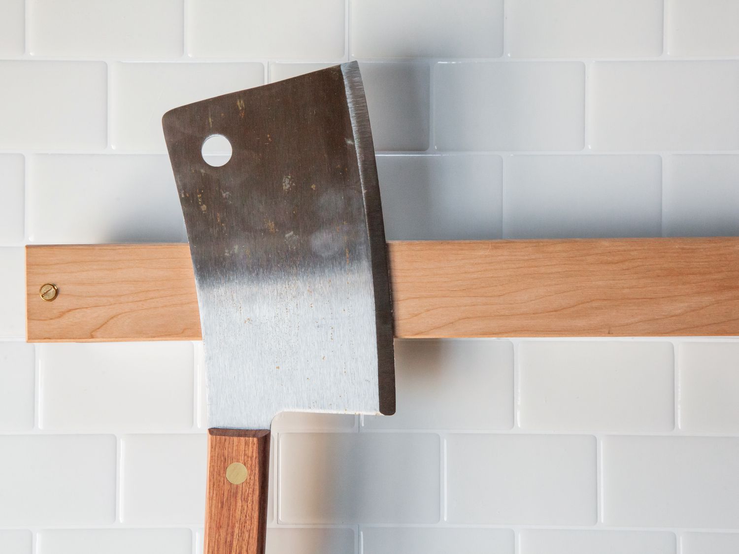 A cleaver on a magnetic knife strip