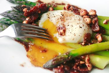 Asparagus and a poached egg with walnut vinaigrette.