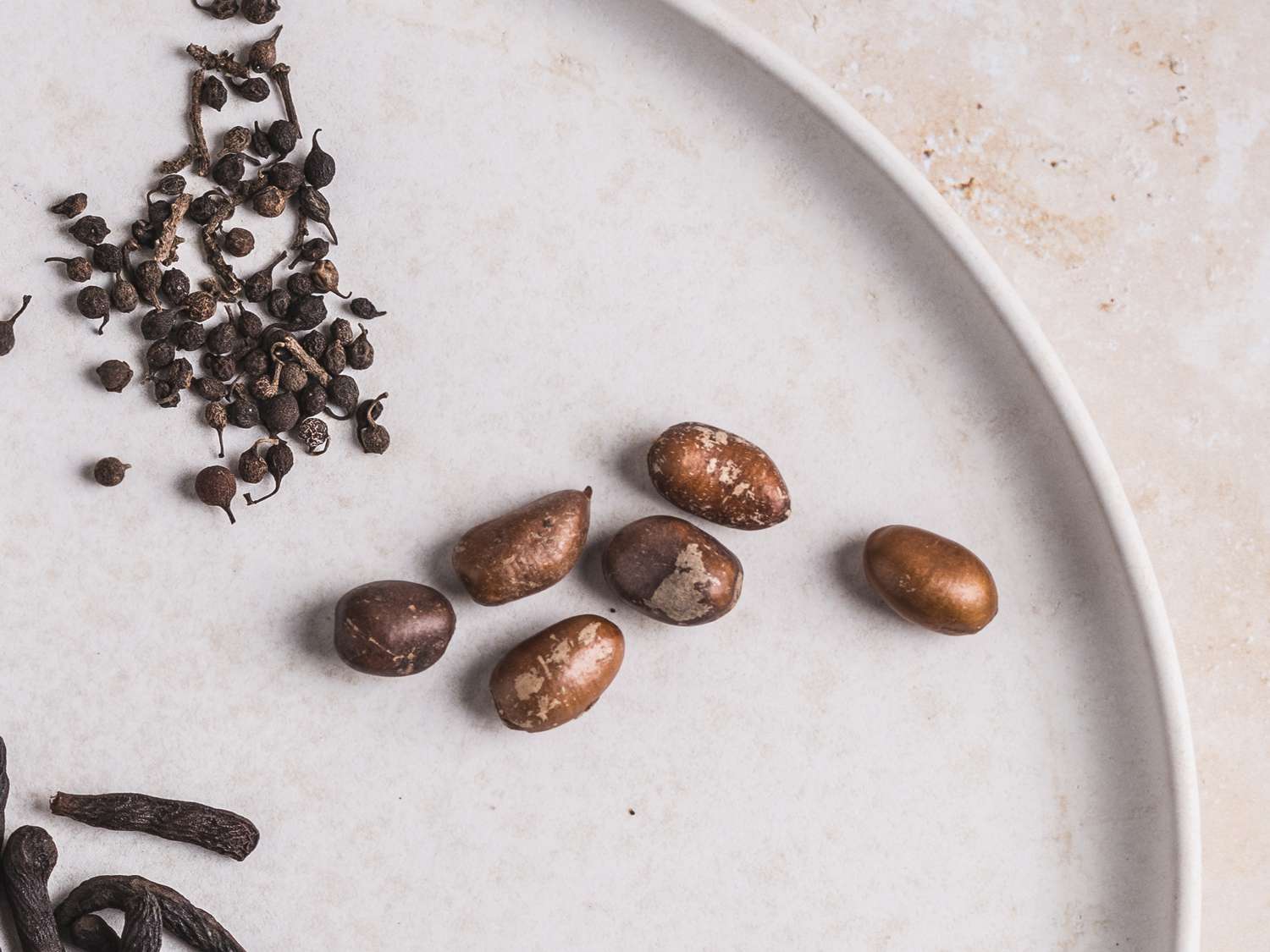 Close up view of seeds and nuts on a grey plate