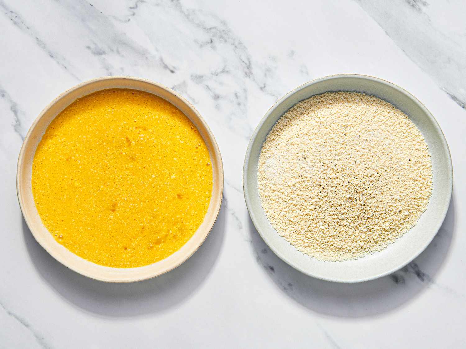 Overhead view of eggs and breadcrumbs