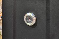 The thermometer on the Cuisinart COS-244 Vertical 36-inch Propane Smoker
