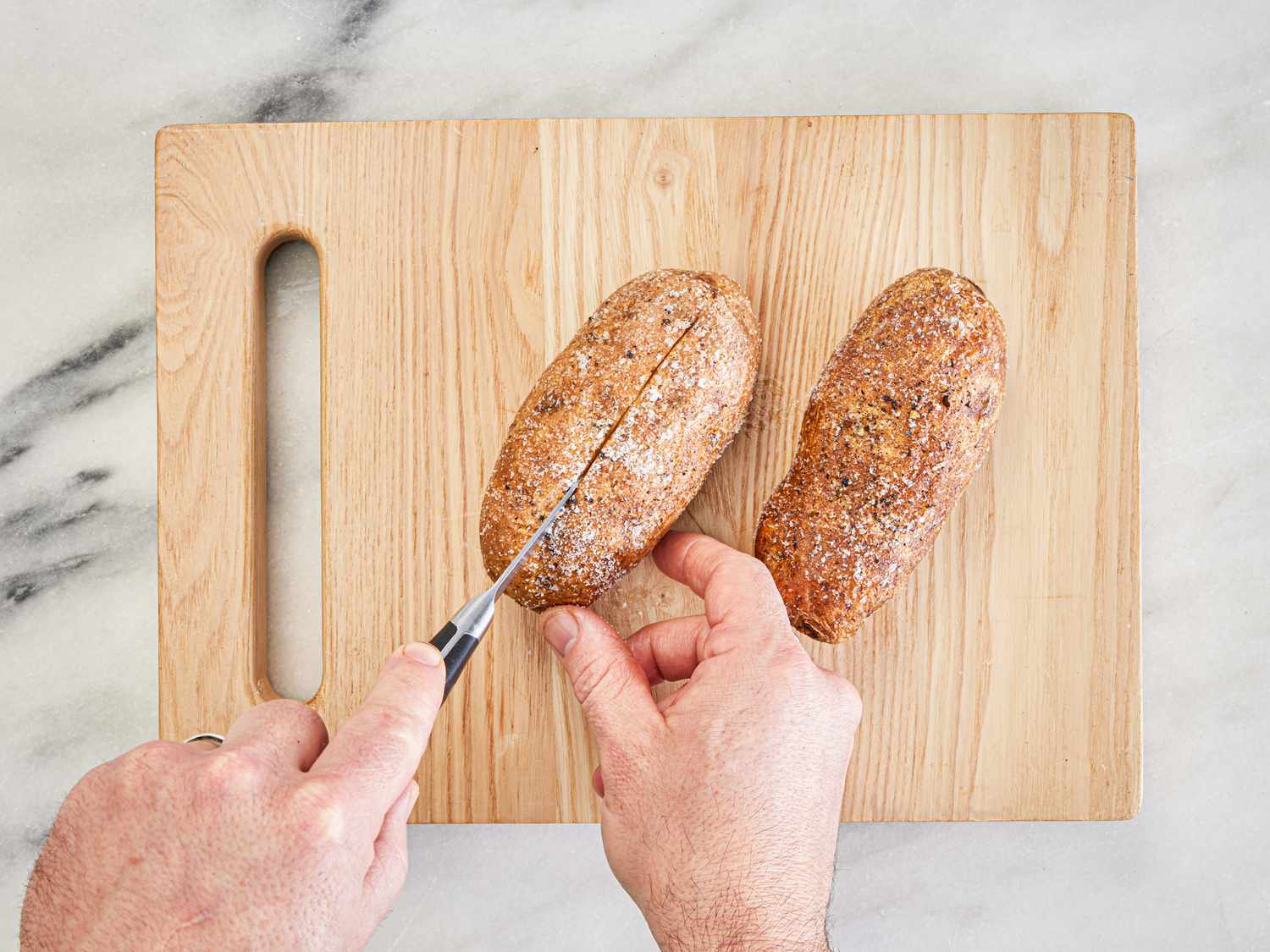 Overhead view of slicing the potato