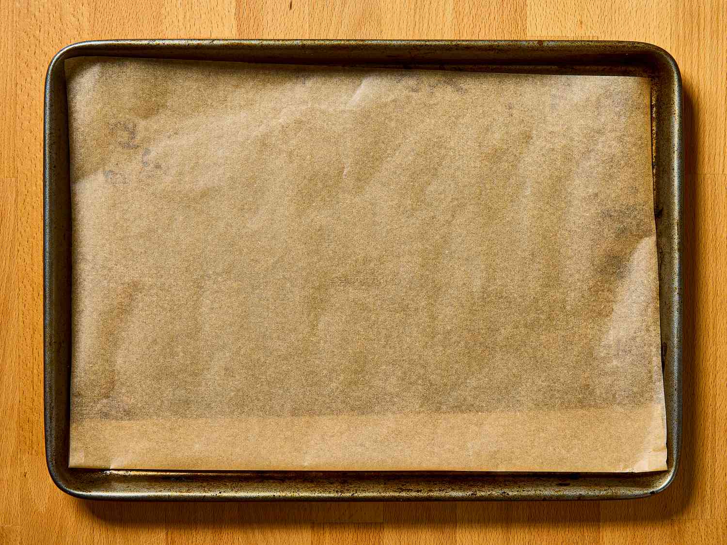 Overhead view of parchment on sheet tray