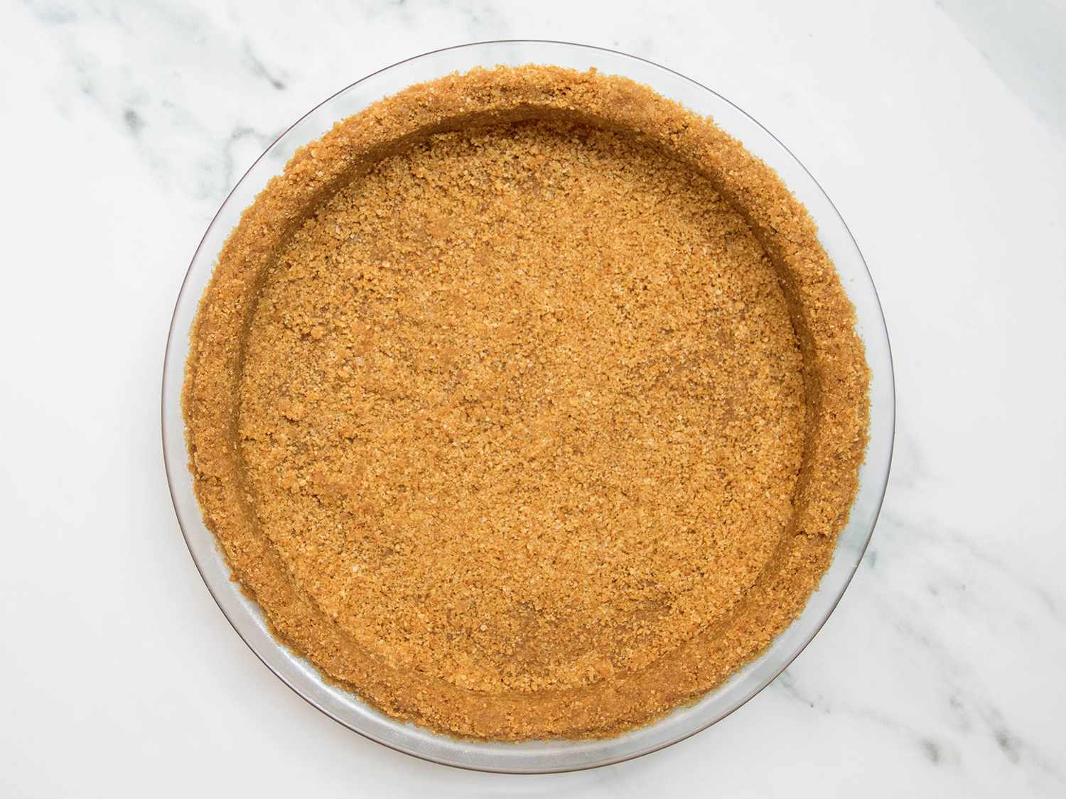 Baked vegan graham cracker crust in pie plate